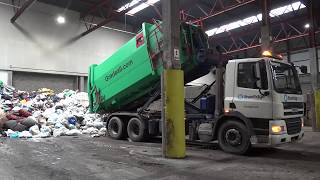 Emptying Gradeall Hook Lift Portable Waste Compactor [upl. by Swisher661]